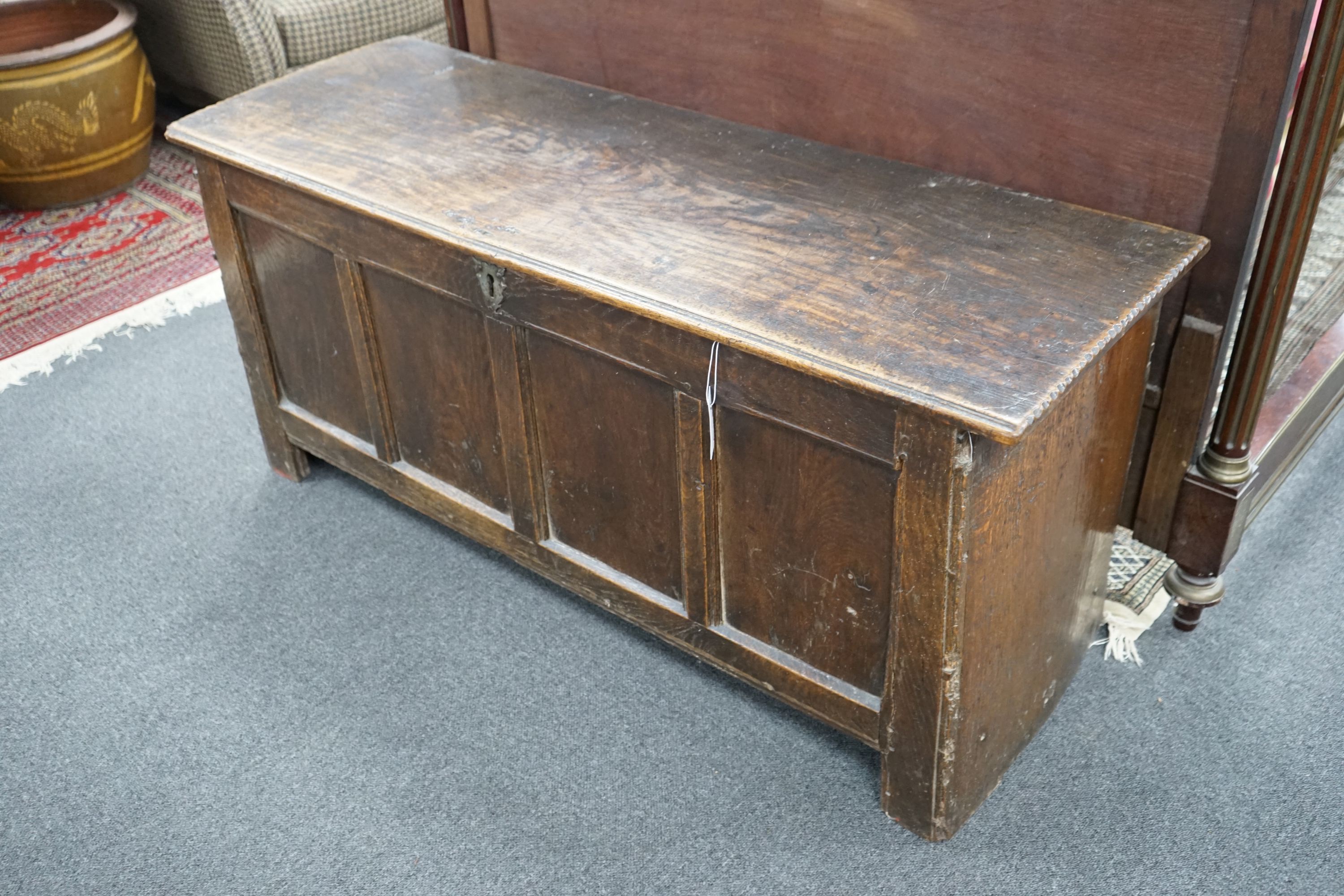 An 18th century panelled oak coffer, length 133cm, depth 46cm, height 59cm